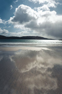 Scenic view of beach against sky