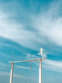 Low angle view of pole against blue sky