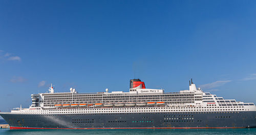 Low angle view of building against clear blue sky