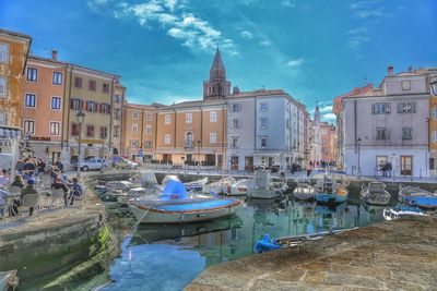 Boats moored in canal