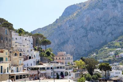 Buildings in town against mountains in capri, italy.