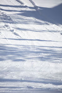 High angle view of snowcapped landscape against sky