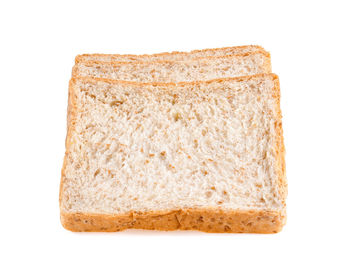 Close-up of bread against white background