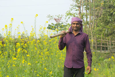 Full length of woman standing on field