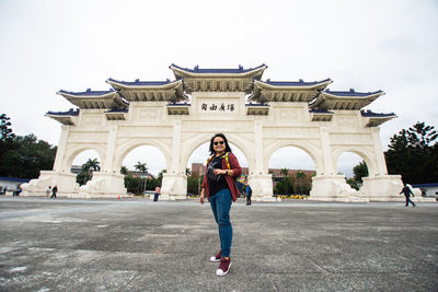 Woman in front of historical building