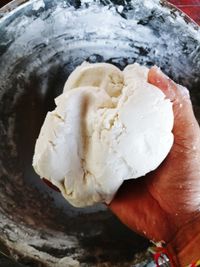 Close-up of hand holding ice cream