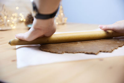 Low section of woman sitting on table