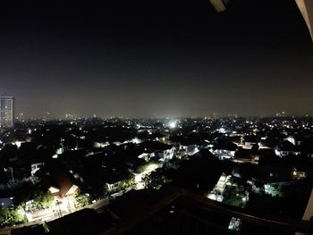 Aerial view of illuminated cityscape at night