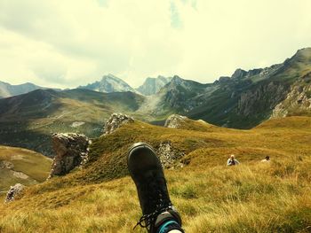 Man standing on mountain against sky