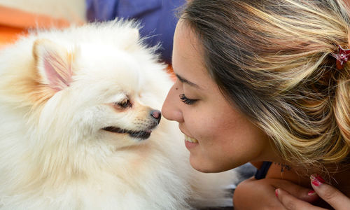 Close-up of woman with dog