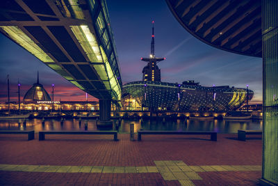 Illuminated modern buildings in city at night