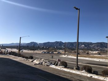 Street against clear blue sky