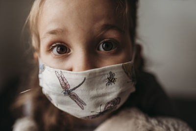 Detailed close up portrait of young girl with mask on