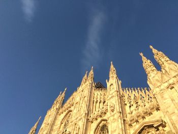 Low angle view of temple building against blue sky