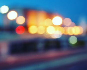 Defocused image of illuminated city at night