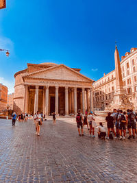Group of people in front of historical building