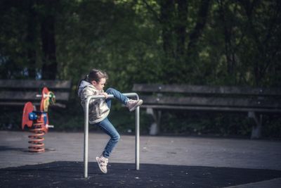 Full length of girl playing at playground