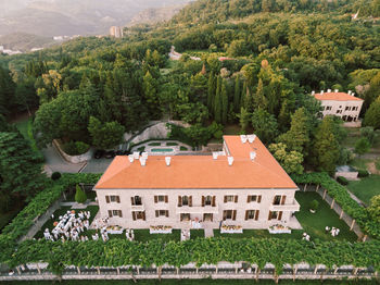 High angle view of trees and buildings in city