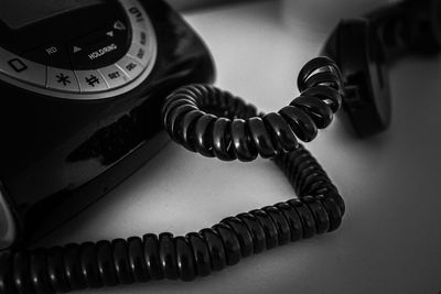 Close-up of telephone booth on table