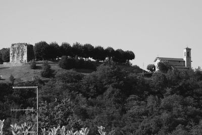 High angle view of trees and buildings against clear sky