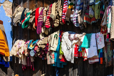 Multi colored flags hanging for sale at market stall