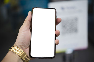Close-up of hand holding smart phone