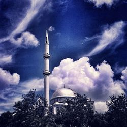 Low angle view of tower against blue sky