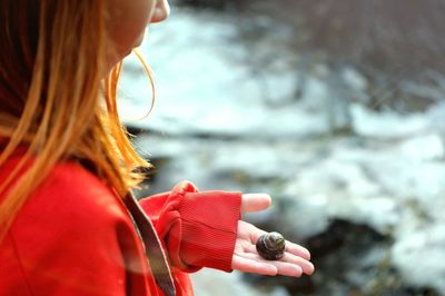 Close-up of girl holding hermit crab