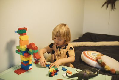 Girl playing with toy blocks