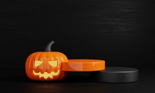 Close-up of pumpkin on table against black background