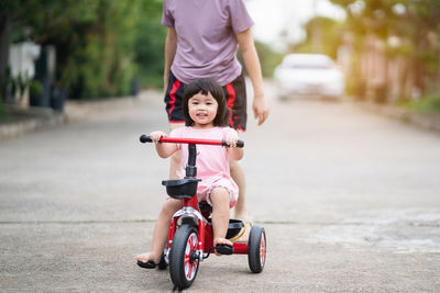 Girl riding bicycle in city