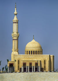 Low angle view of temple against clear blue sky