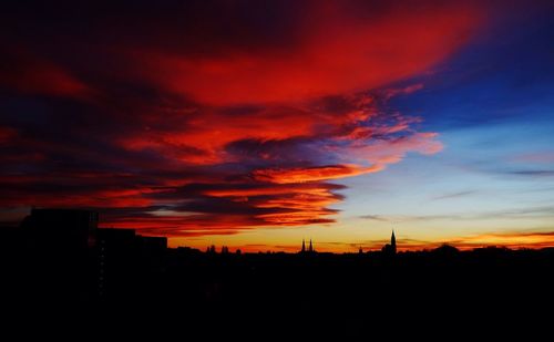 Silhouette of landscape against dramatic sky