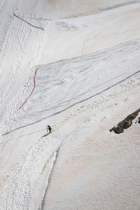 High angle view of person skiing on snowcapped mountain