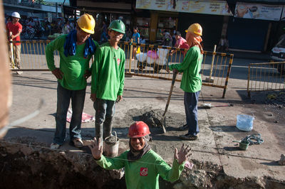 Portrait of people working at construction site