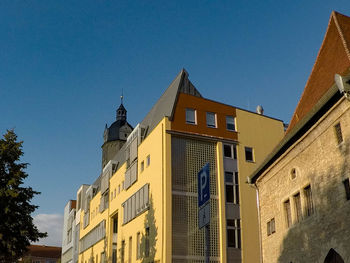 Low angle view of buildings against clear sky