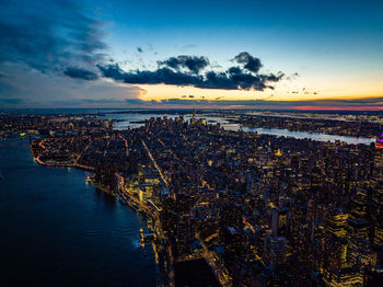 High angle view of city at sunset