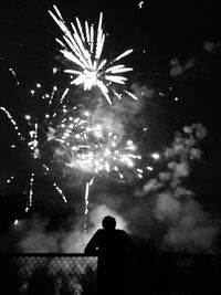 Low angle view of firework display at night