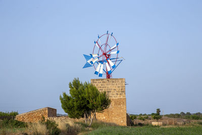 Built structure on field against clear sky