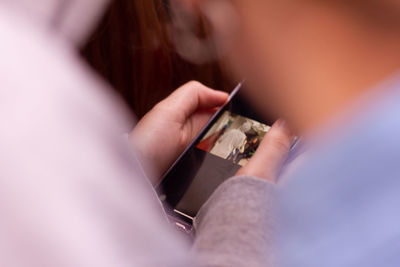 Close-up of person using mobile phone