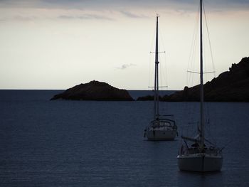 Sailboat on sea against sky