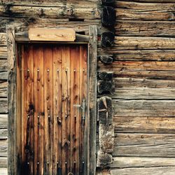Old wooden door of log cabin