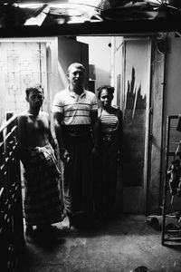 Men standing in corridor