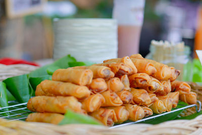 Delicious group of crispy spring roll on banana leave sell in local market of thailand. 