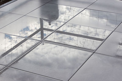 Low angle view of reflection of clouds in sky