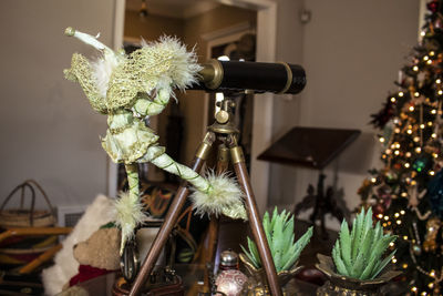 Close-up of potted plant on christmas tree at home