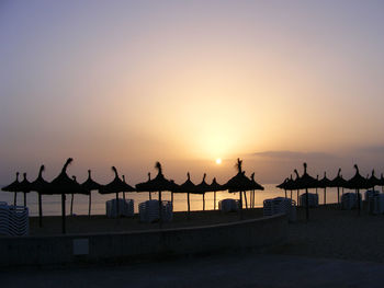 Silhouette of gazebo at sunset