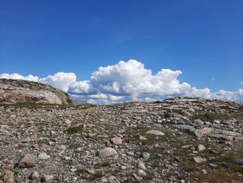 Scenic view of landscape against blue sky