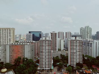 Buildings in city against sky