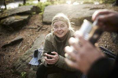 Smiling woman holding cup